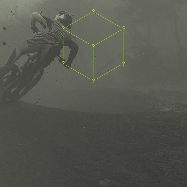 Background of an MTB Rider and a minimalistic Mystery Box with question marks on its corners.